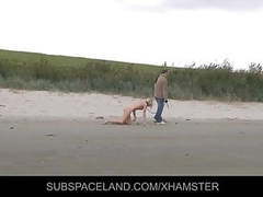 Free Kilo Movies presents: Slim blonde slave leashed and whipped on the beach