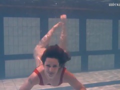 Free Kilo Movies presents: Swimming brunette in one piece swimsuit
