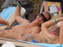 Free Kilo Movies presents: Tattooed girl and her topless friend tanning topless